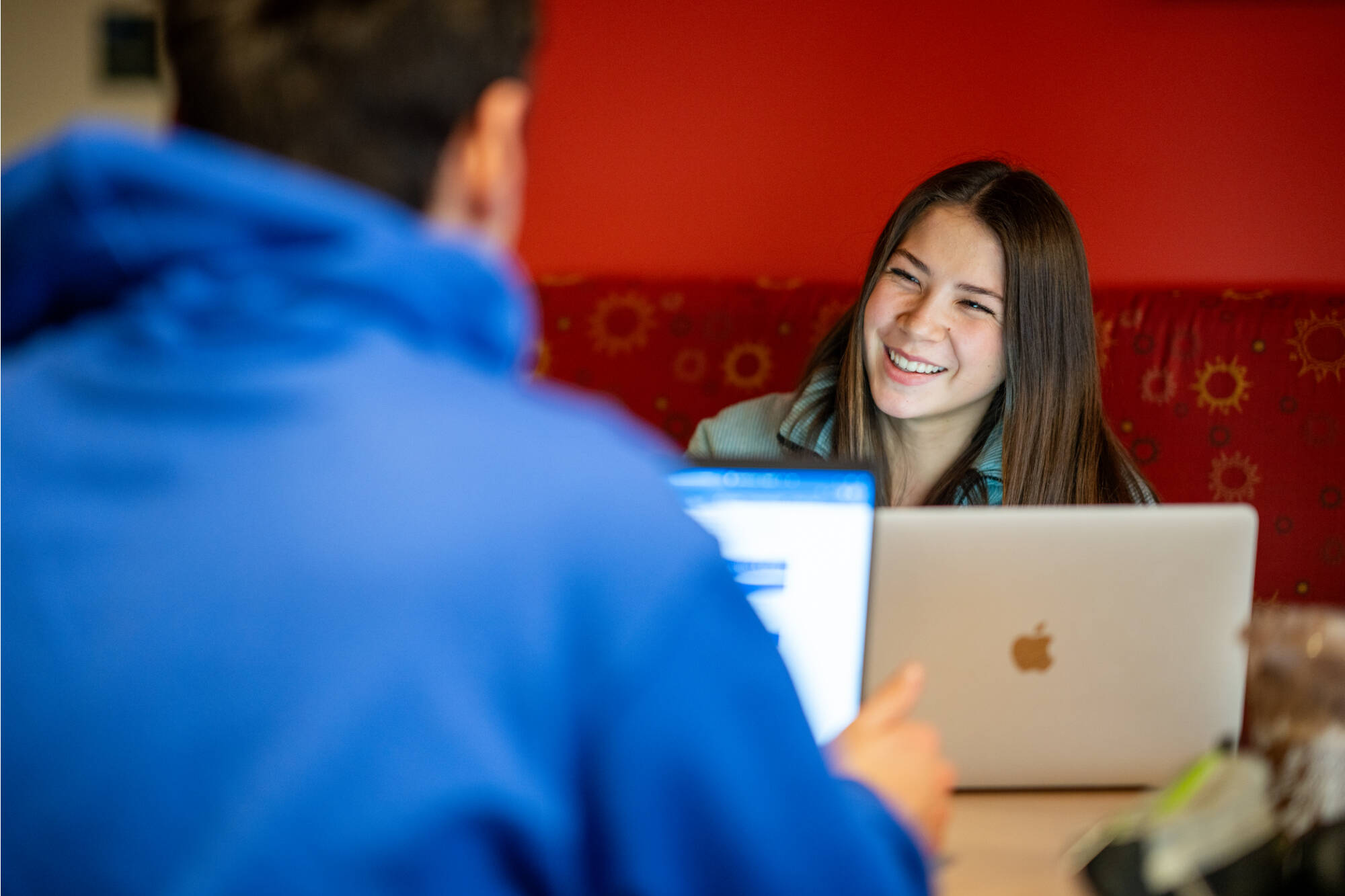 Student talks with a friend while studying in the Mary Idema Pew Library January 25, 2024. (Photo by Amanda Pitts)
